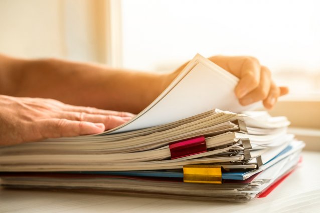 side-view-man-arranging-business-files.jpg